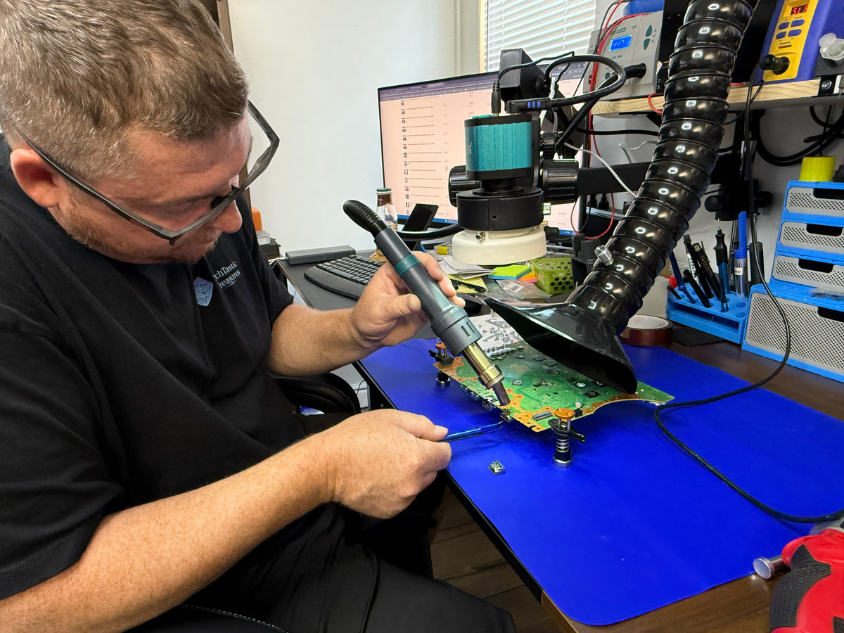 TechTastic technician performing electronics repair